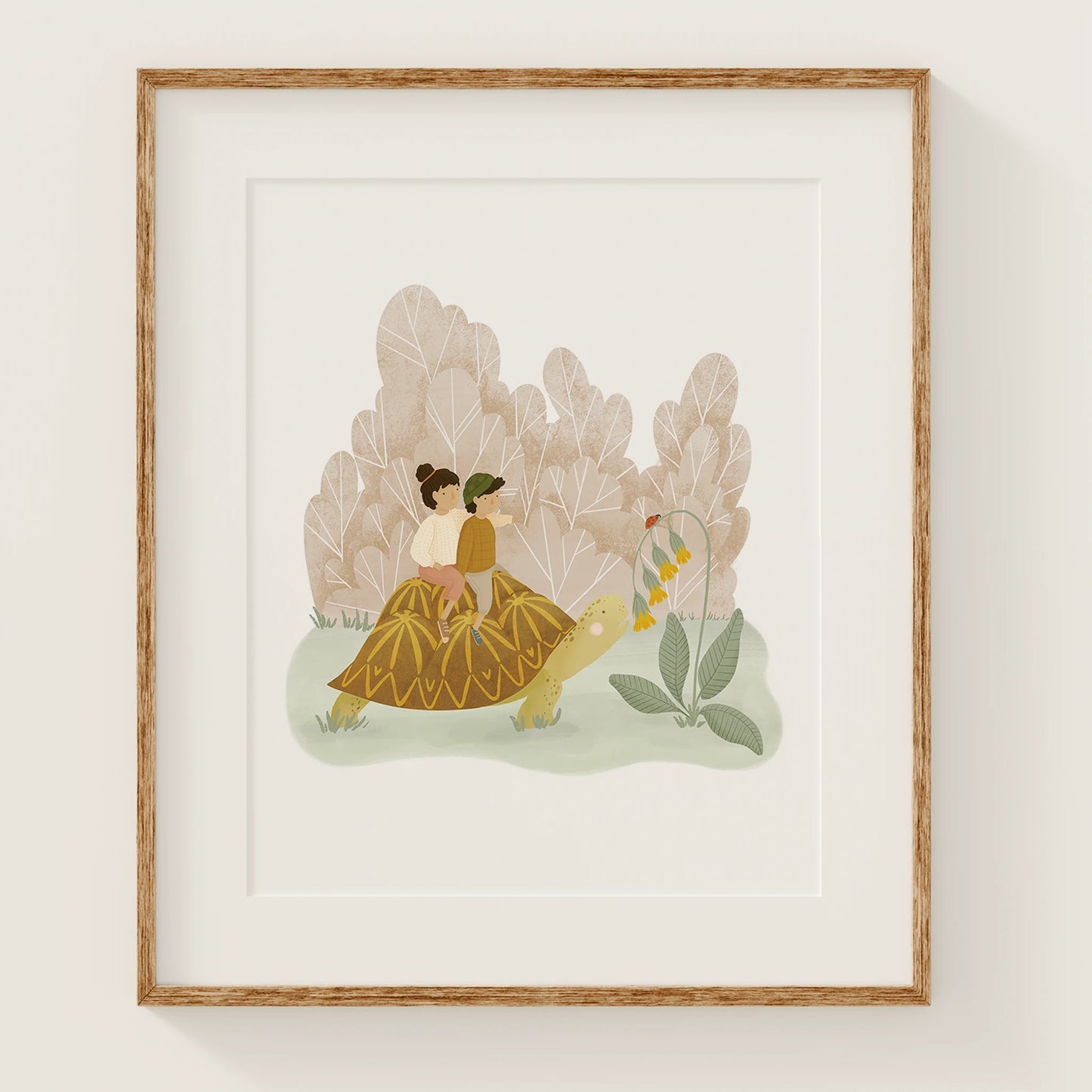 in no hurry art print, shown in a wood frame. print features a two kids, riding on a turtle, pointing out a ladybug perched atop some yellow flowers that the turtle is about to munch.