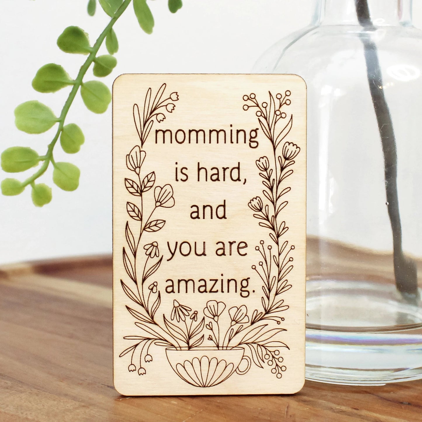 unique mini wood mother's day card that reads 'momming is hard and you are amazing' decorated with flowers coming from a mug.
