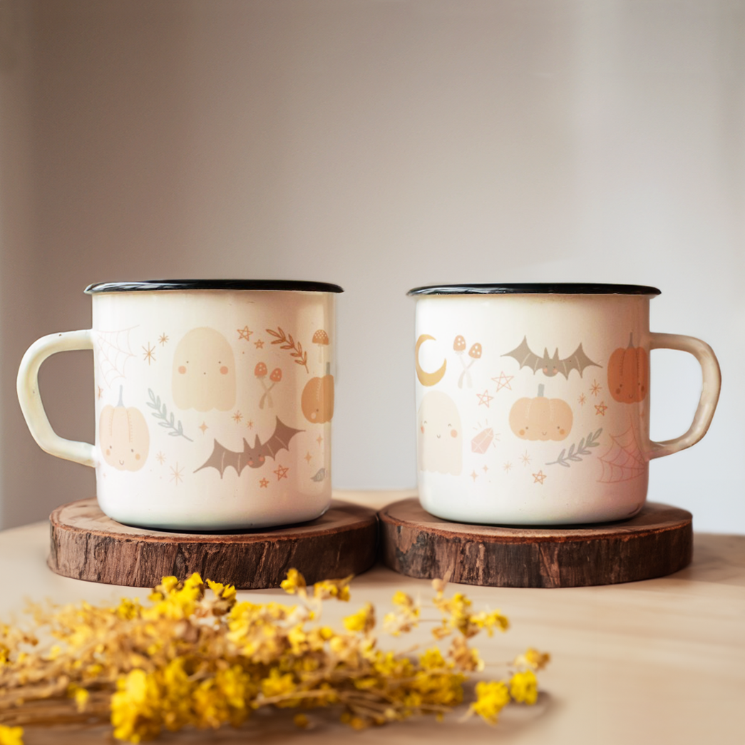 two enamel mugs with cute halloween design--ghosts, bats, pumpkins, stars, moon and mushroom.