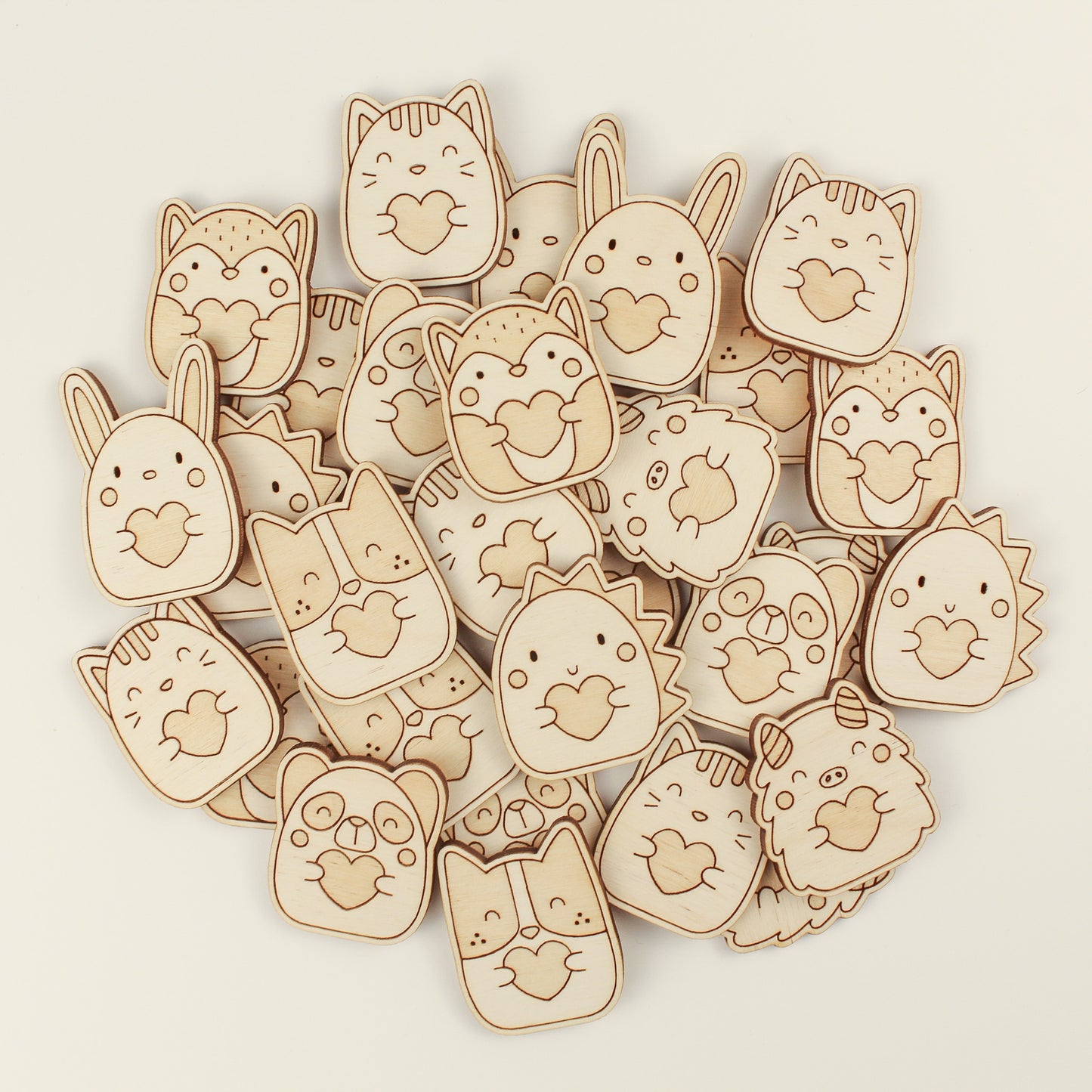 pile of wooden pocket hugs on a white background.