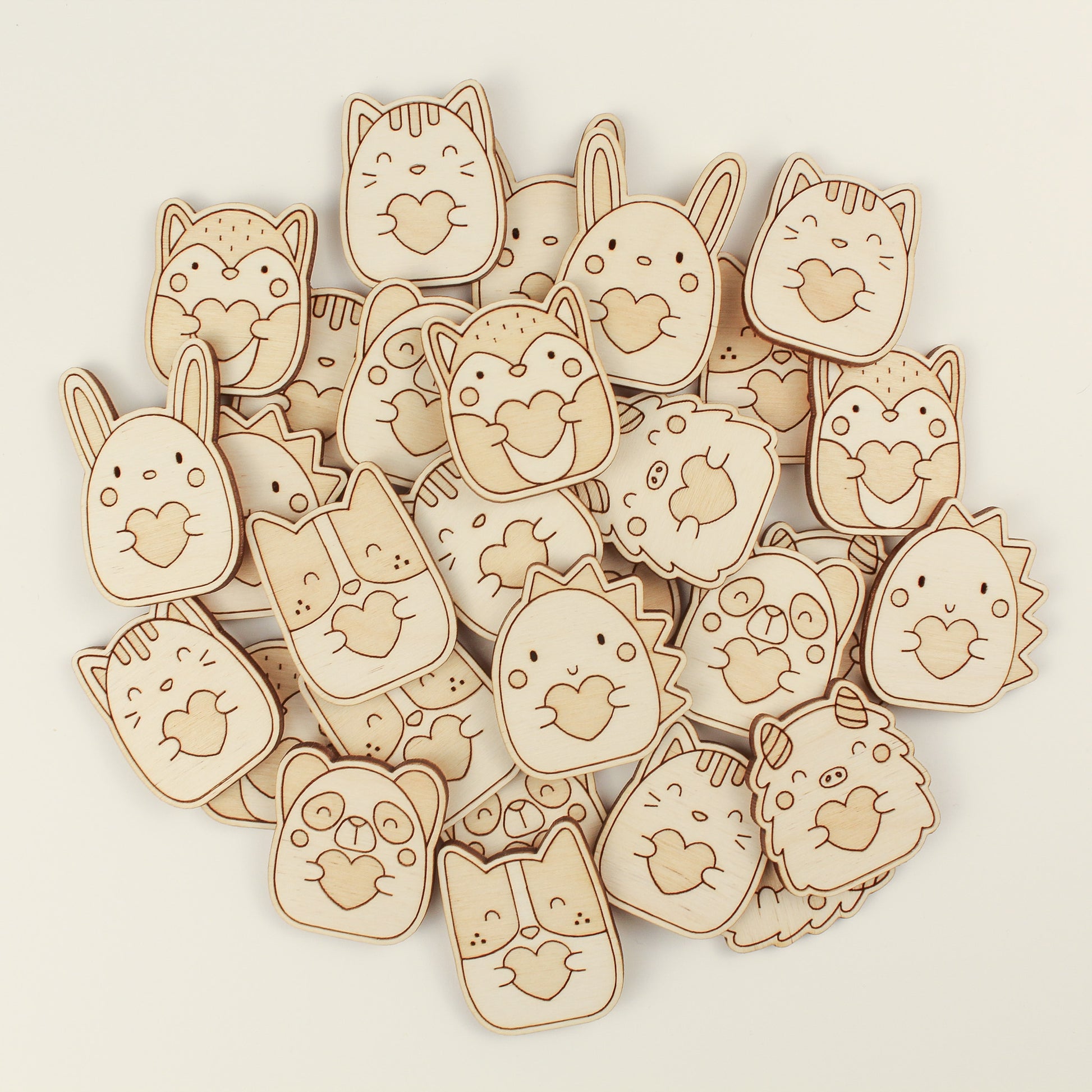 pile of wooden pocket hugs on a white background.