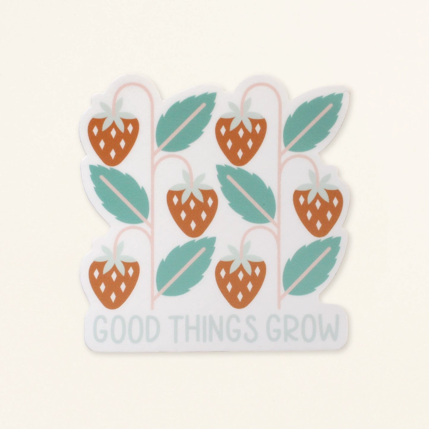 strawberry vinyl sticker in red and green with the words good things grow in light blue