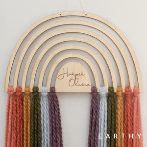 personalized wood and yarn rainbow wall hanging