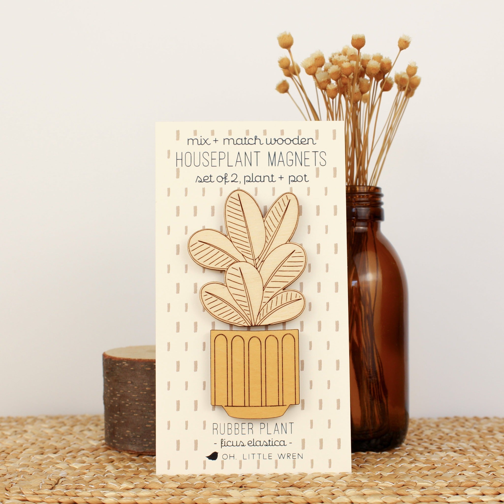 wooden plant and pot magnet pair. with rubber plant and mustard yellow pot.