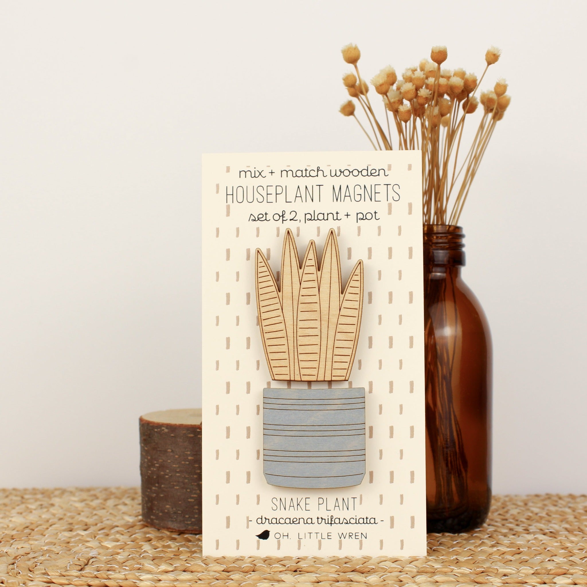 wooden plant and pot magnet pair. with snake plant and blue pot.