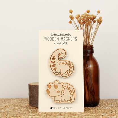 wooden dinosaur magnet pair with a brontosaurus and triceratops with leafy details