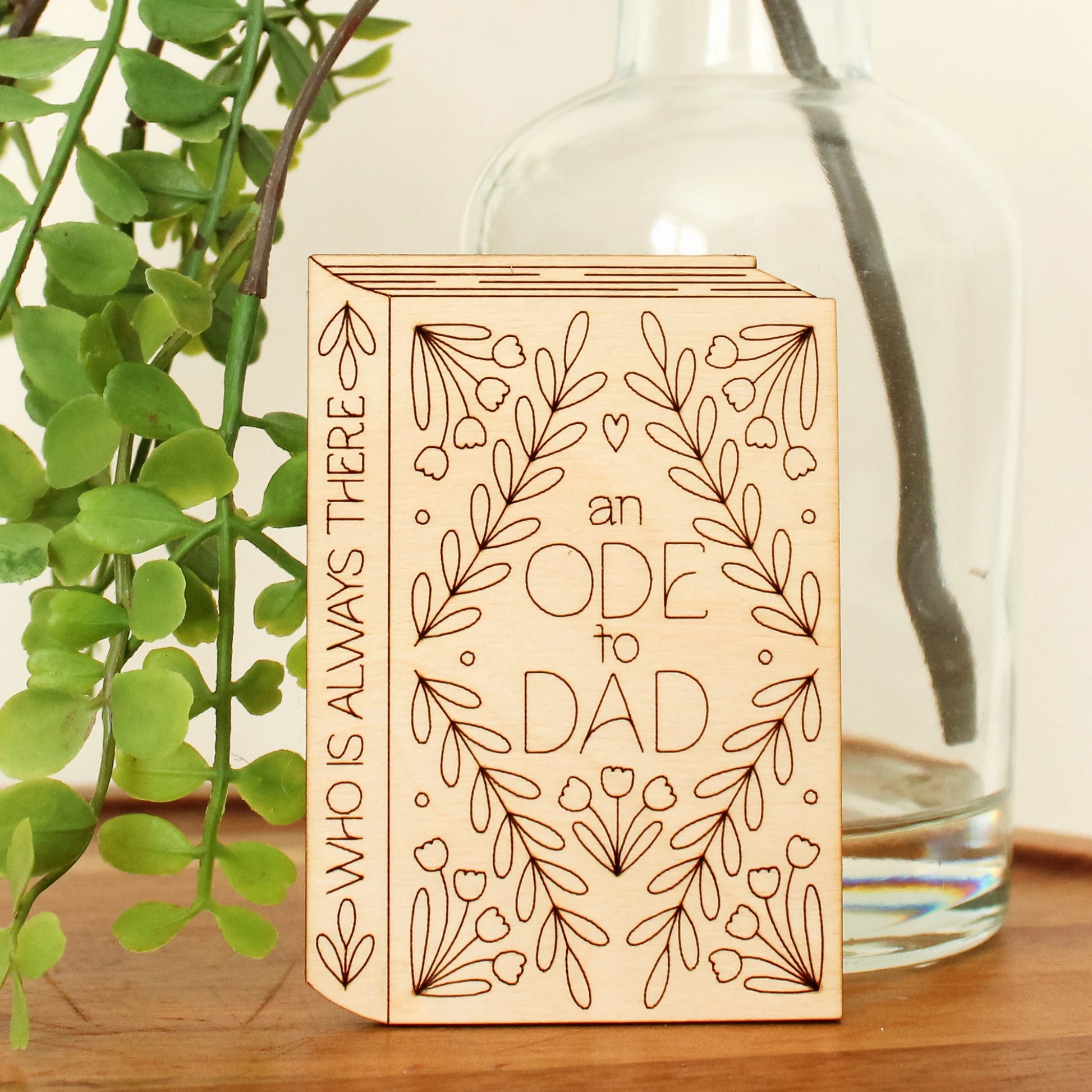 mini wood book shaped card. cover text reads 'an ode to dad' and spine text reads 'who is always there'