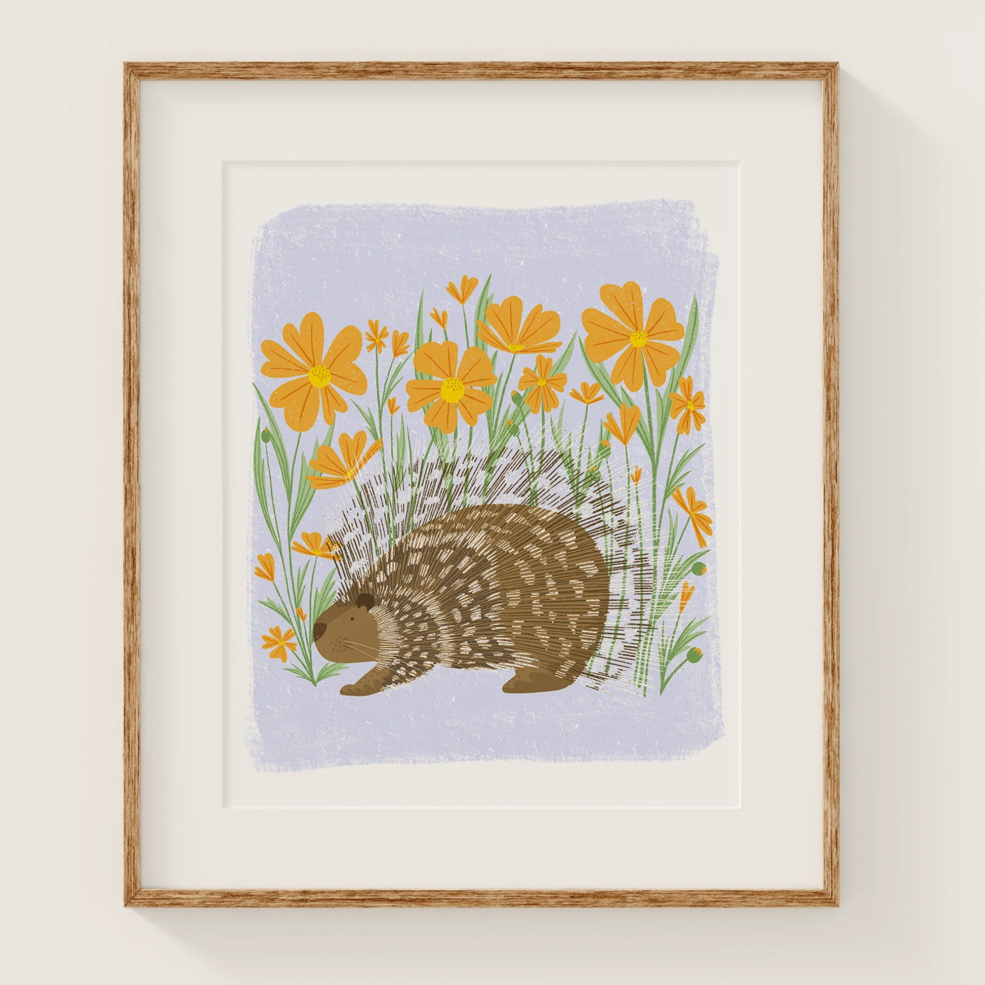 'flower frolic' art print, shown in a wood frame. print features a whimsical porcupine in front of orange flowers.