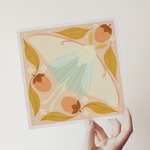 load image into gallery viewer, art print showing a luna moth in pale greens and pinks, surrounded by orange persimmons and mustard yellow leaves. shown being held in a hand.
