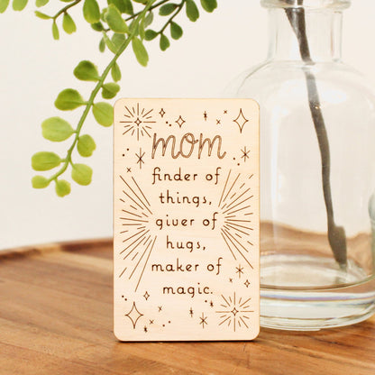 mini wood mother's day card that reads "mom finder of things, giver of hugs, maker of magic'