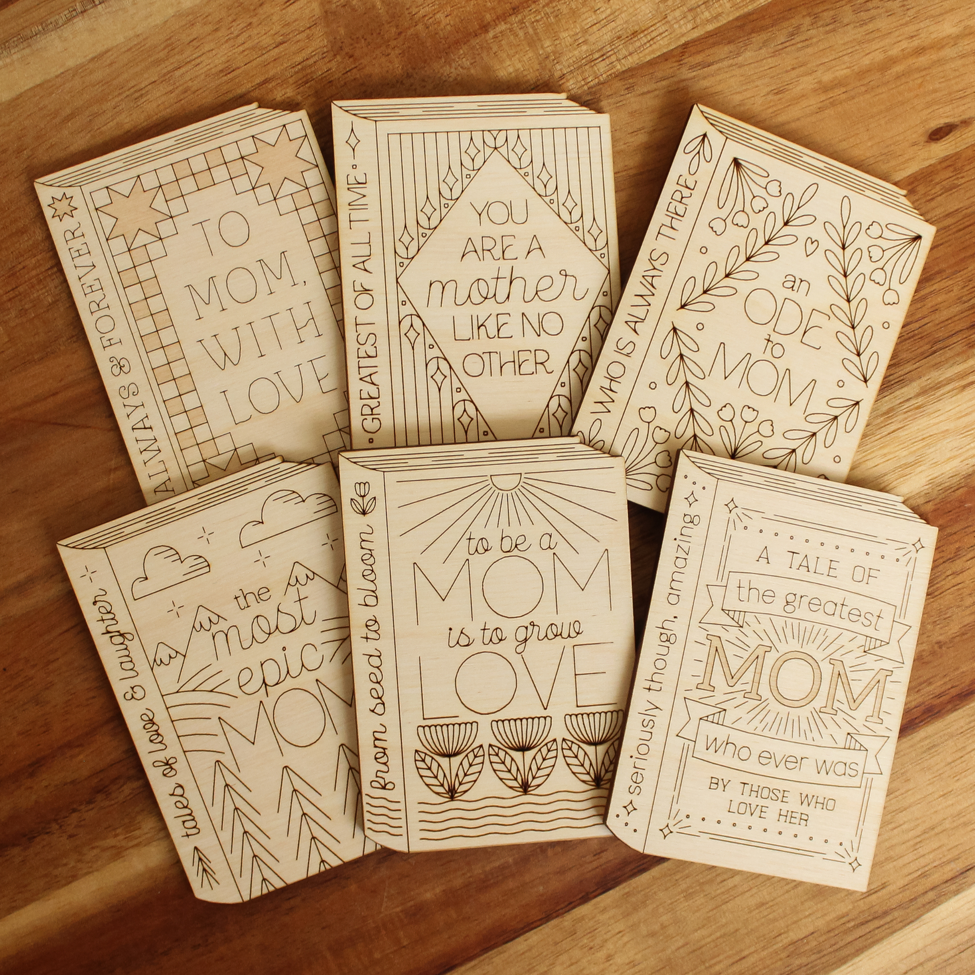 collection of all 6 wooden book shaped cards.
