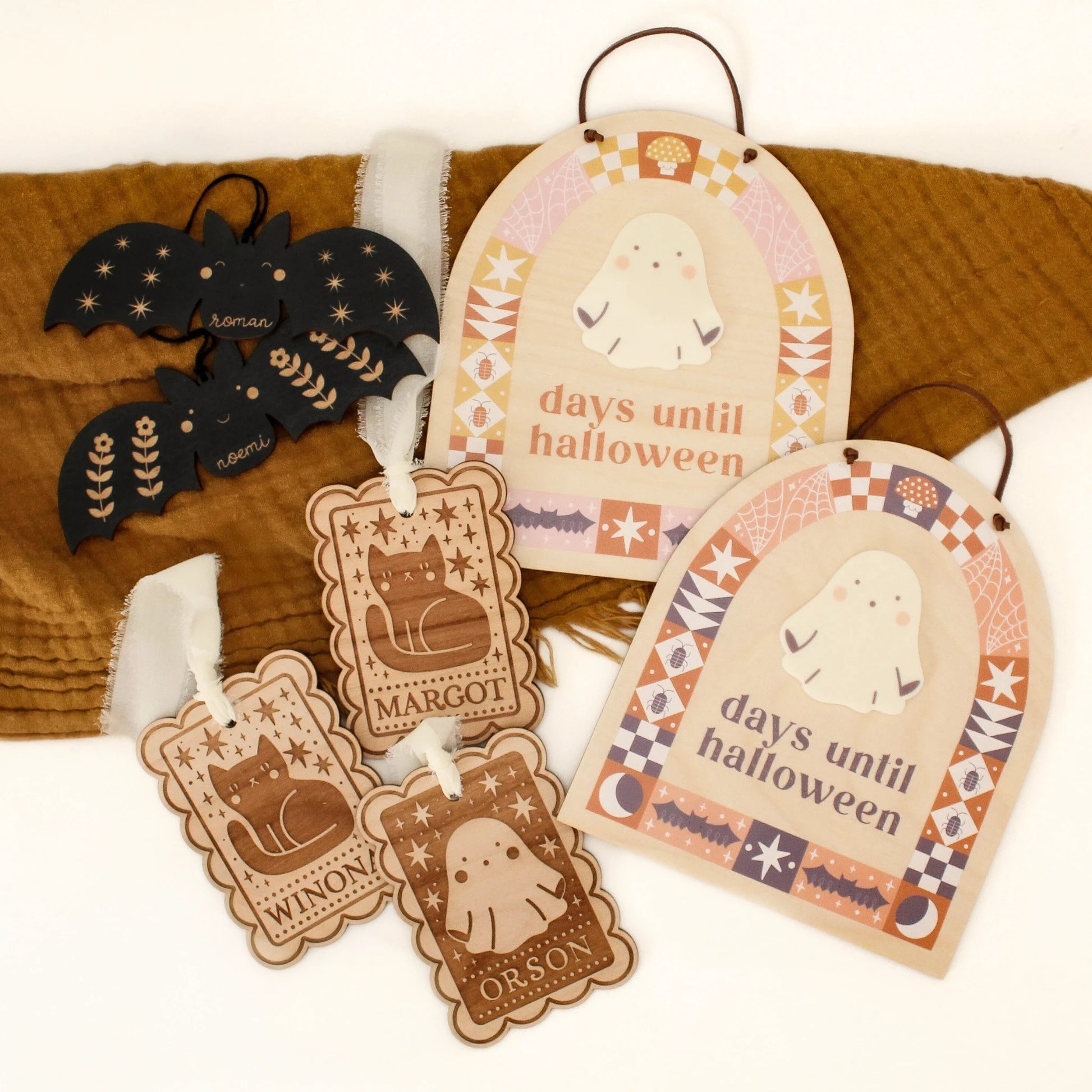 collection of halloween products including black bat tags, ghost and black cat folksy tags, and halloween countdown signs