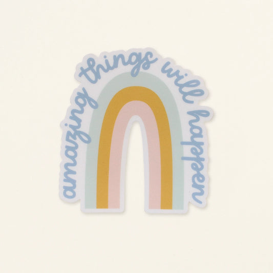 Sticker with rainbow design and 'amazing things will happen' text on a light background