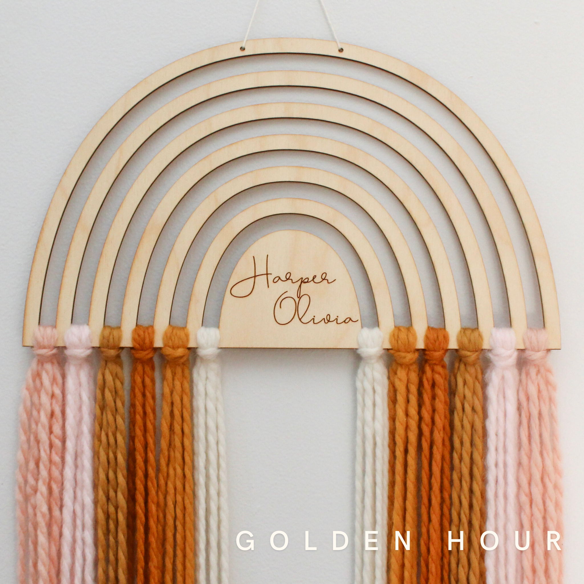 personalized wood and yarn rainbow wall hanging