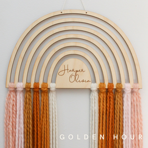 personalized wood and yarn rainbow wall hanging