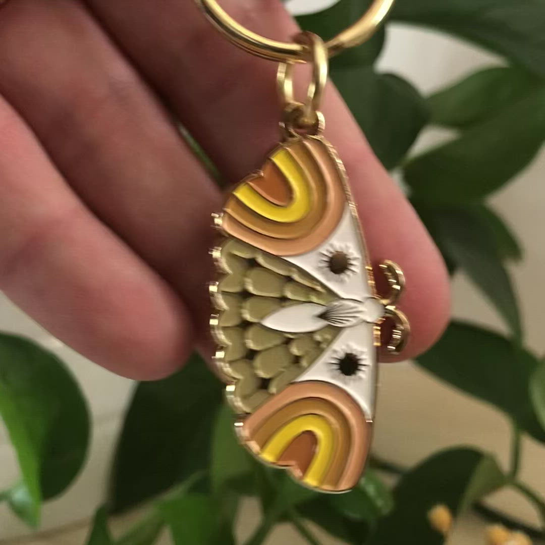 moth enamel keychains