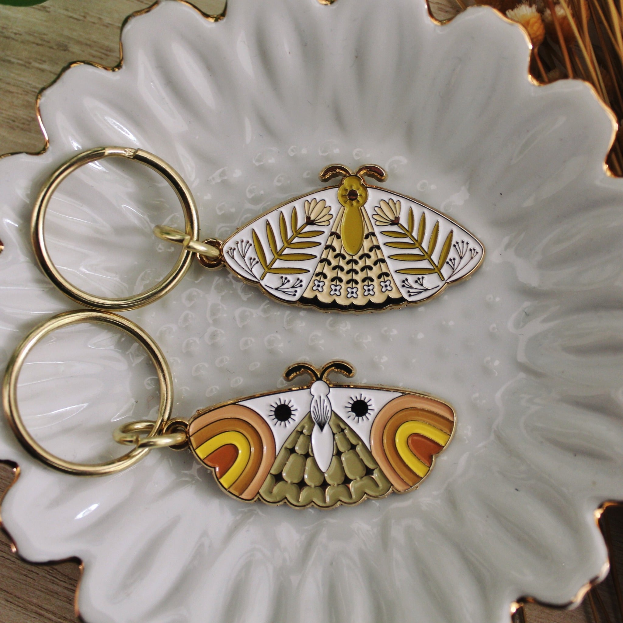 moth enamel keychains