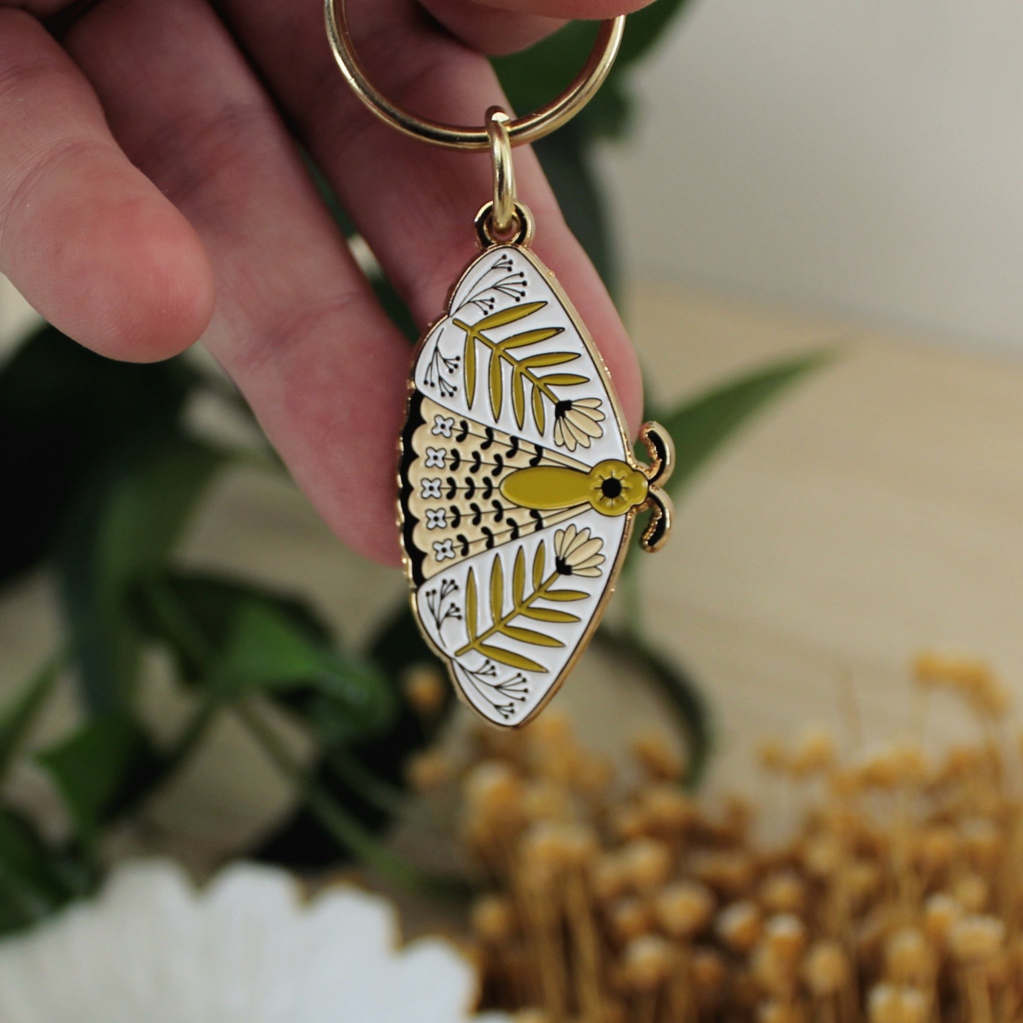 moth enamel keychains
