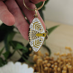load image into gallery viewer, moth enamel keychains

