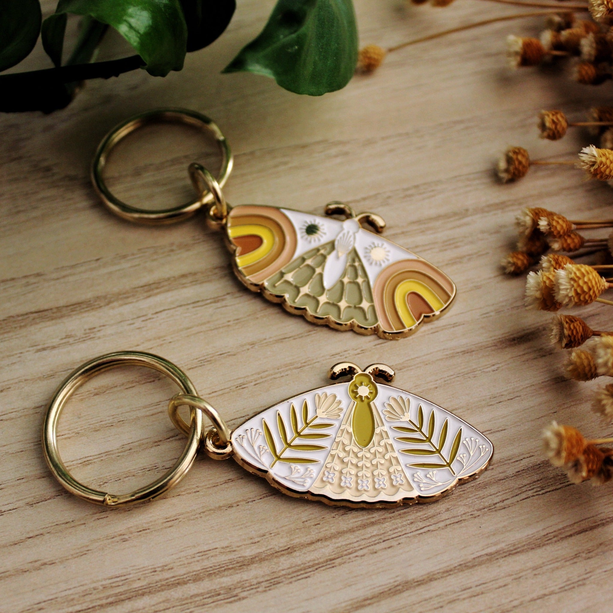 moth enamel keychains