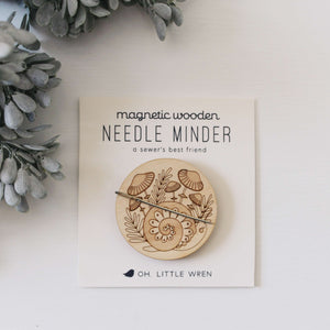 forest snail wooden needle minder