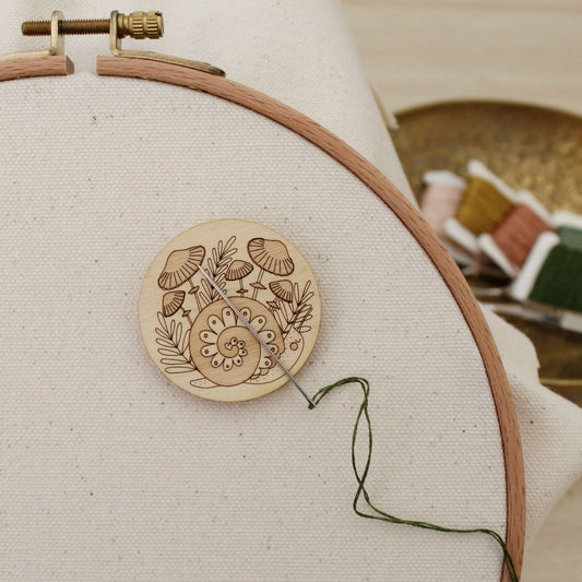 forest snail wooden needle minder