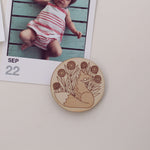 load image into gallery viewer, pair of circular wooden magnets, one with a fox surrounded by flowers and the other with a snail and mushrooms.
