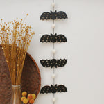 load image into gallery viewer, vertical bats wooden folk halloween garland, black and white starburst
