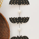 load image into gallery viewer, vertical bats wooden folk halloween garland, black and white starburst
