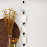 load image into gallery viewer, vertical ghosts wooden folk halloween garland, black and white starburst
