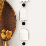 load image into gallery viewer, vertical ghosts wooden folk halloween garland, black and white starburst
