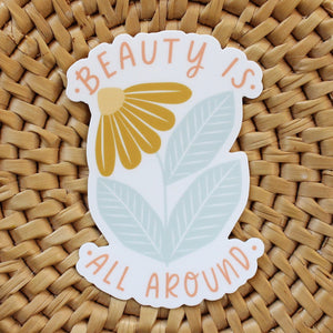 flower vinyl sticker in mustard and dusty blue with words beauty is all around us in peach