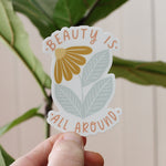load image into gallery viewer, flower vinyl sticker in mustard and dusty blue with words beauty is all around us in peach
