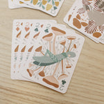 load image into gallery viewer, a woodland, forest themed deck of cards featuring beautifully illustrated animals, flowers and mushrooms. 
