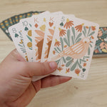 load image into gallery viewer, a woodland, forest themed deck of cards featuring beautifully illustrated animals, flowers and mushrooms. 
