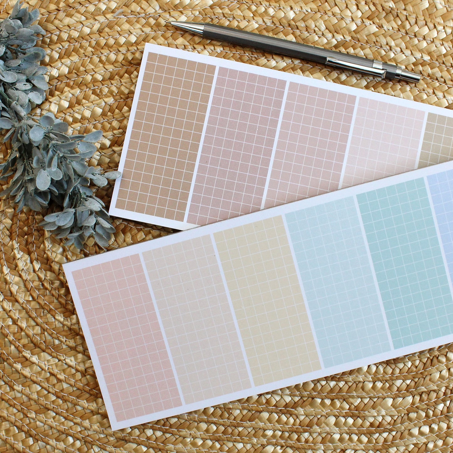 grid lined notepads in rainbow colors and muted pinks and browns