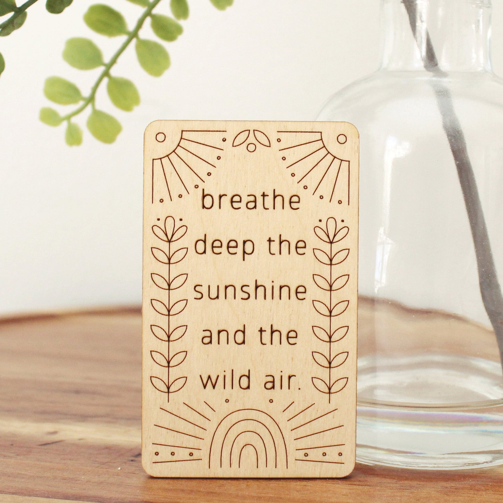 mini wooden affirmation card that reads 'breathe deep the sunshine and the wild air.'