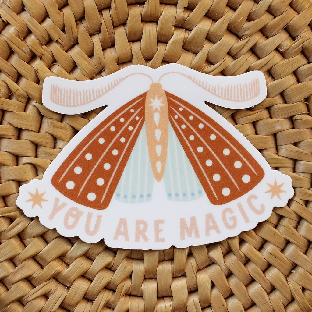 rust, peach and light blue moth vinyl sticker with the words you are magic