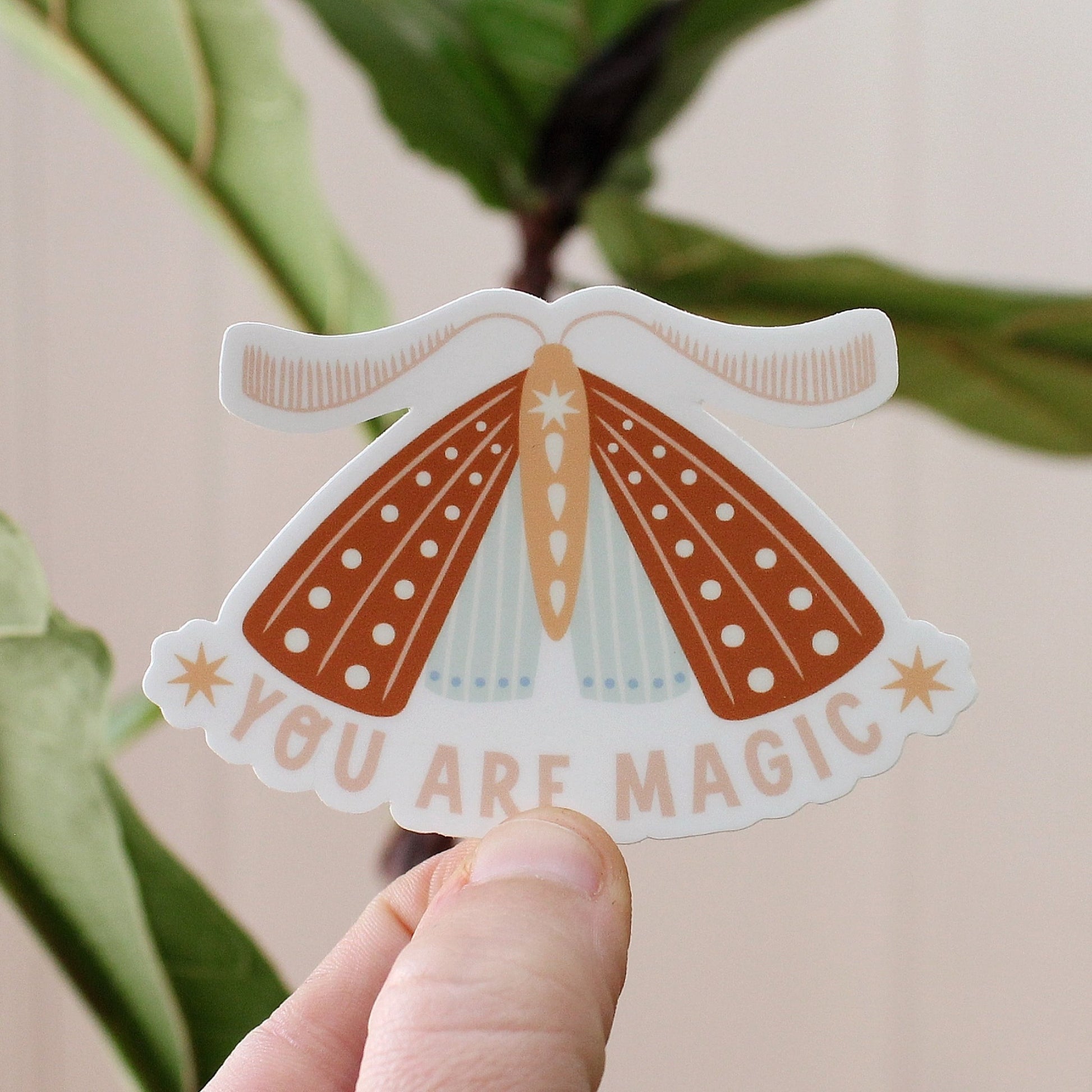 rust, peach and light blue moth vinyl sticker with the words you are magic