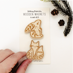 load image into gallery viewer, wooden woodland animal magnet pair with a rabbit and fox with leafy details
