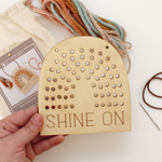 load image into gallery viewer, wooden rainbow banner stitching kit with shine on text and and yarn to stitch yourself.

