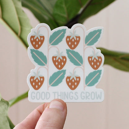 strawberry vinyl sticker in red and green with the words good things grow in light blue
