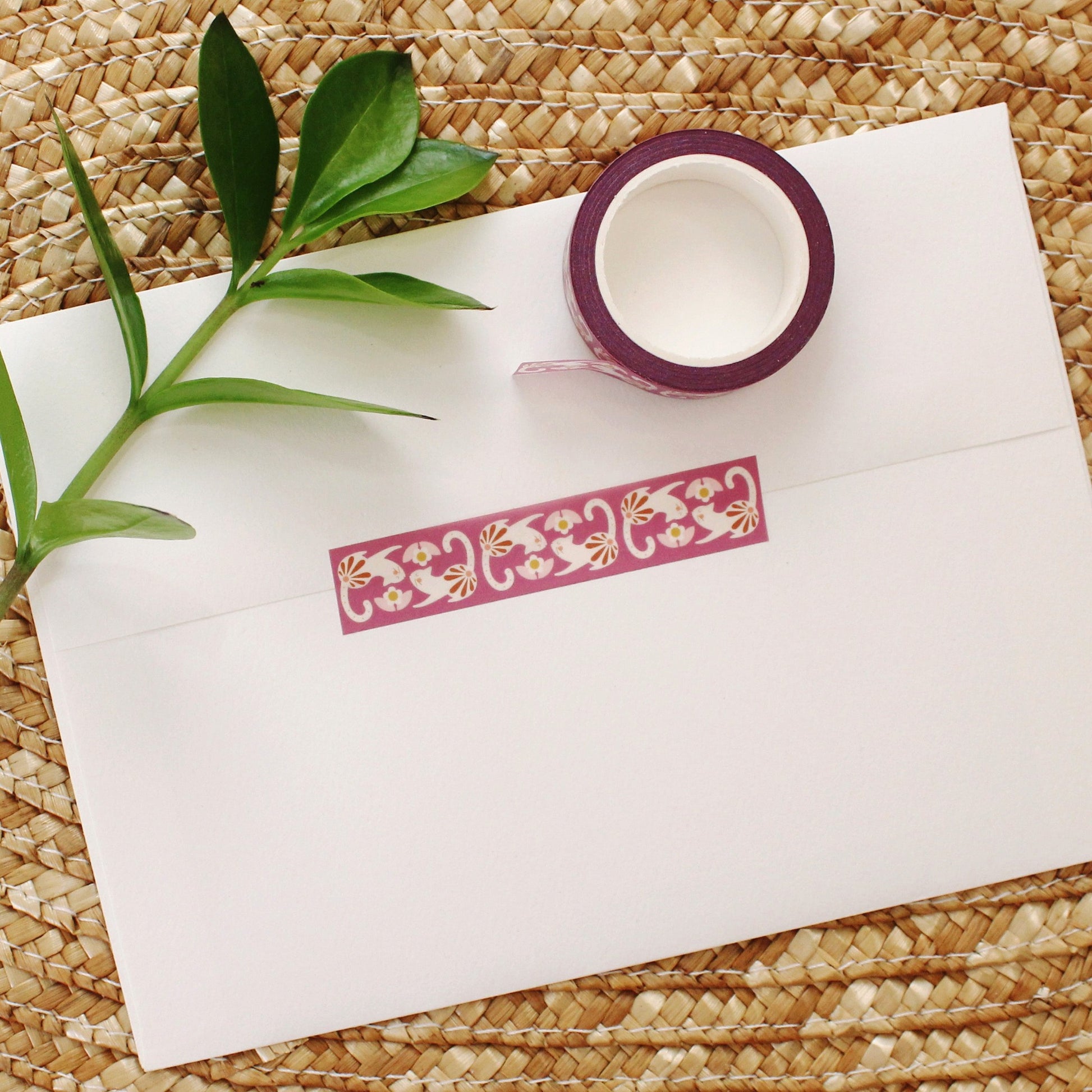 washi tape with cute cats and flowers on a rich plum background.