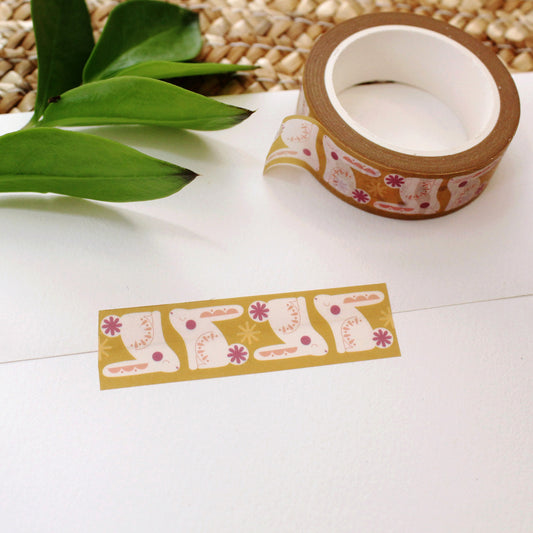cute bunny washi tape on a mustard background with pops of plum and peach color.