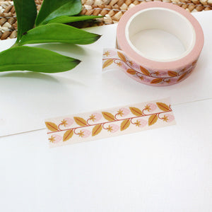 adorable pink strawberry washi tape with mustard yellow leaves on a cream background.