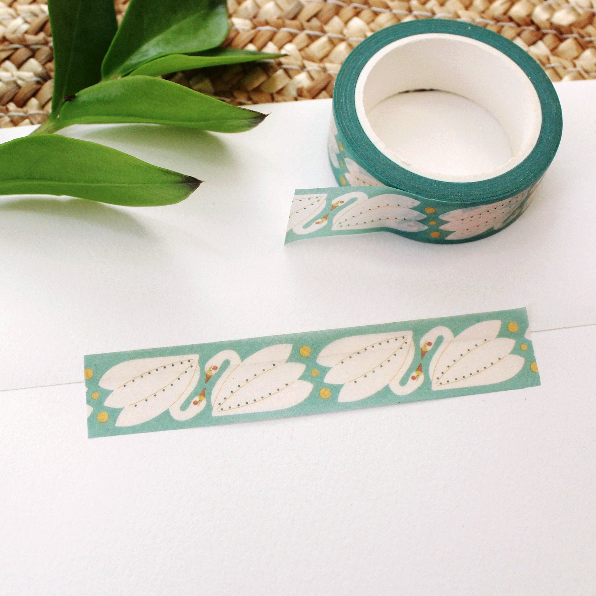 swan washi tape on a teal background with mustard yellow dots.