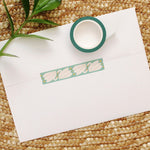 load image into gallery viewer, swan washi tape on a teal background with mustard yellow dots.
